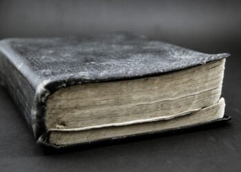 A dusty old book sitting on a table