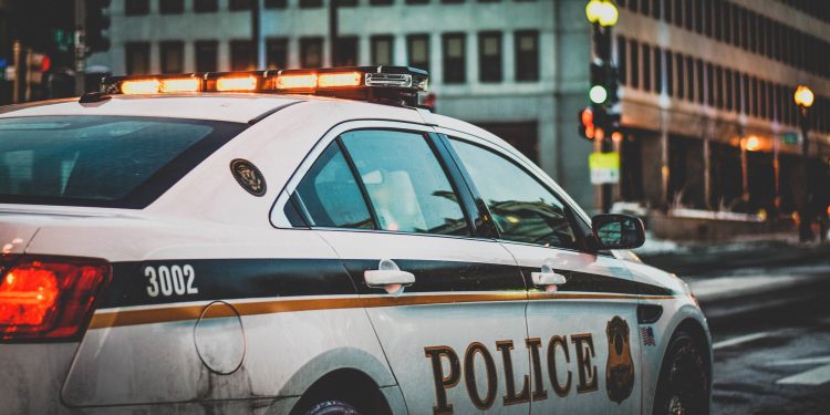 Depiction of police vehicle with root lights on